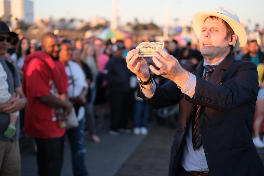 Shaun performing for large crowd demonstrating 15 years of live audience experience